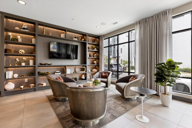 interior space featuring light tile patterned floors and built in shelves