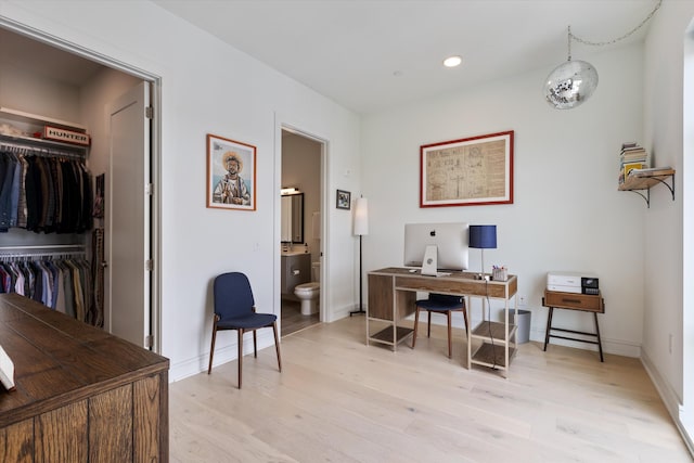 home office featuring light hardwood / wood-style floors