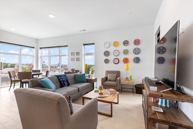 living room with light hardwood / wood-style flooring