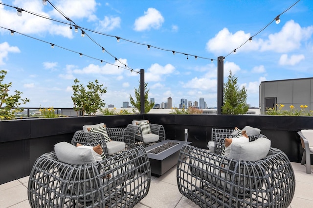 view of patio featuring an outdoor living space with a fire pit