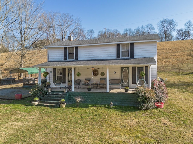 view of front of property with a front yard and a porch