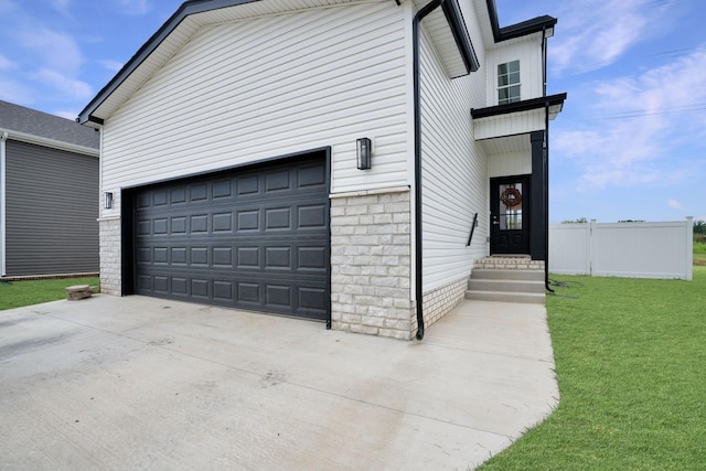 garage with a lawn