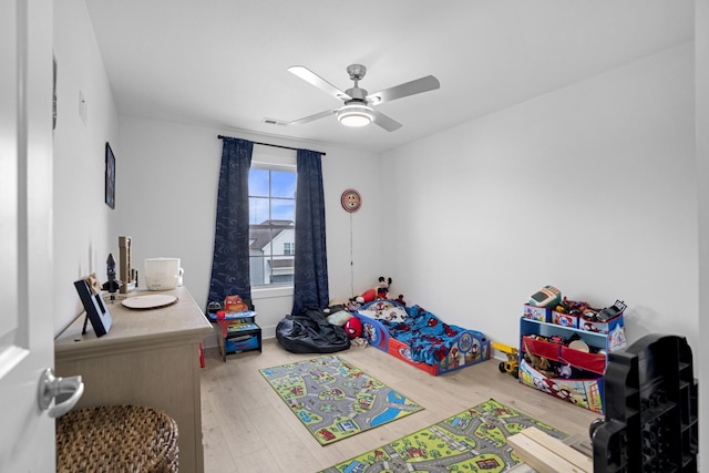 bedroom featuring ceiling fan and hardwood / wood-style floors