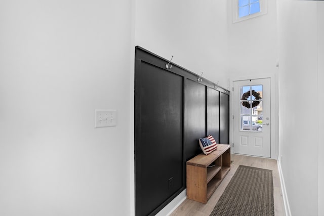 mudroom with light hardwood / wood-style floors