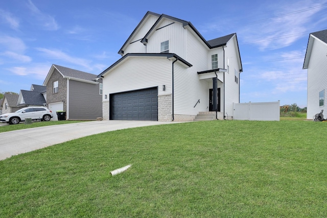 view of front facade featuring a garage and a front yard