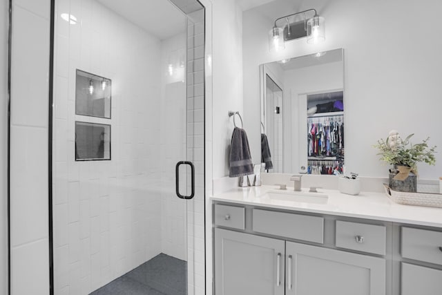 bathroom with vanity and an enclosed shower