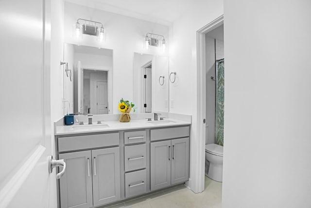 bathroom featuring tile patterned flooring, vanity, a shower with curtain, and toilet