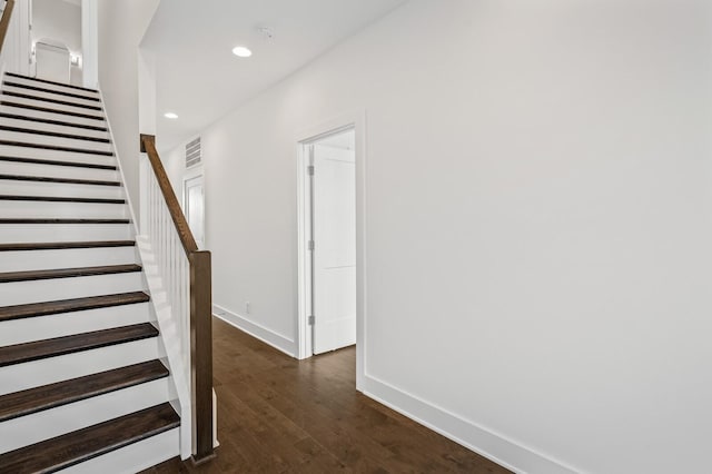 stairs with wood-type flooring