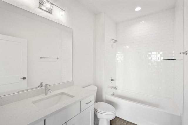 full bathroom featuring vanity, toilet, and tiled shower / bath