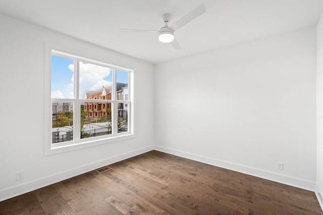 empty room featuring hardwood / wood-style floors and ceiling fan