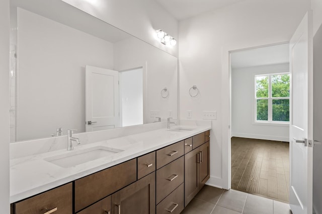 bathroom with tile patterned flooring and vanity