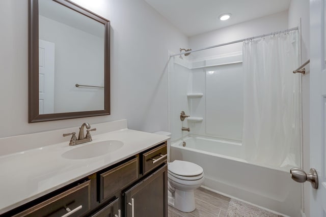 full bathroom with vanity, toilet, and shower / tub combo with curtain