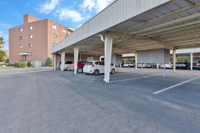 view of parking / parking lot with a carport