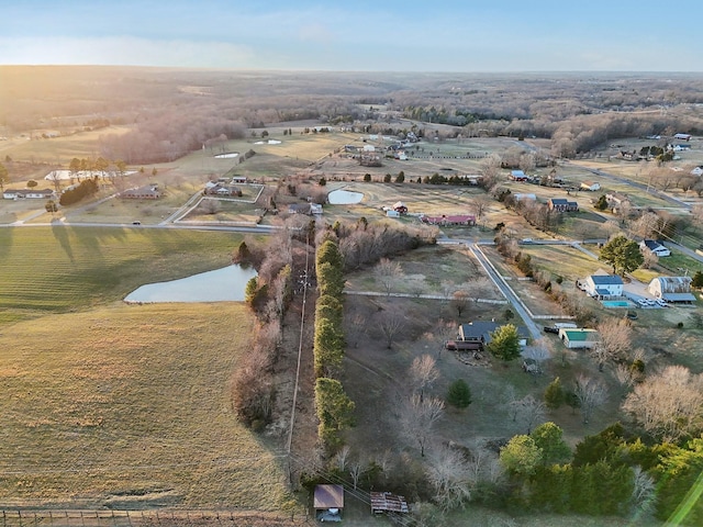 birds eye view of property with a rural view