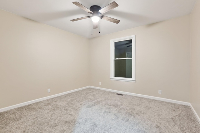 unfurnished room with carpet floors and ceiling fan