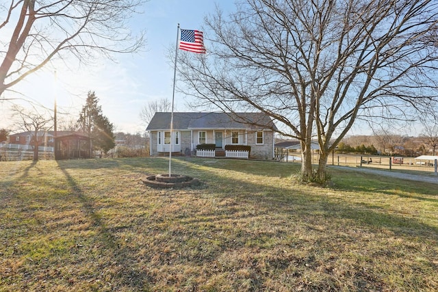 single story home featuring a front lawn