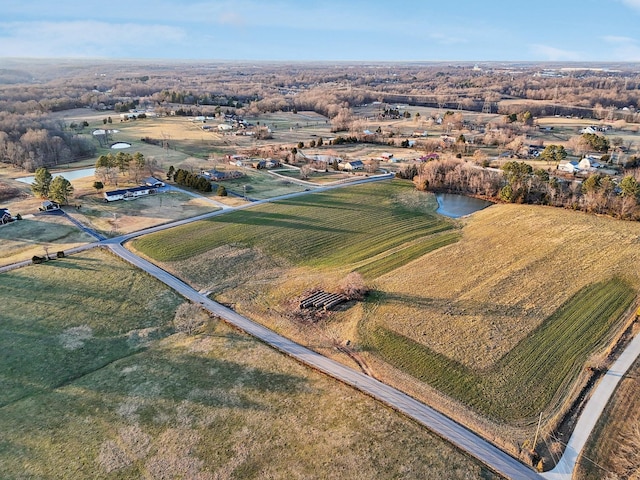 aerial view with a water view and a rural view