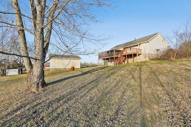 view of yard featuring a wooden deck