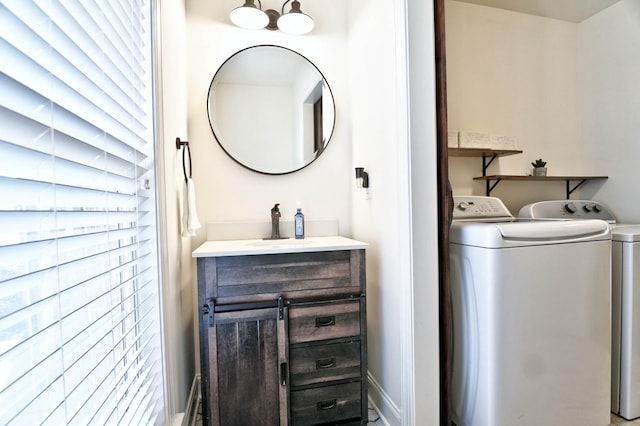 bathroom featuring vanity and washing machine and clothes dryer