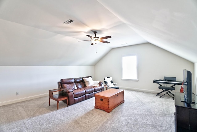 carpeted living room featuring vaulted ceiling and ceiling fan