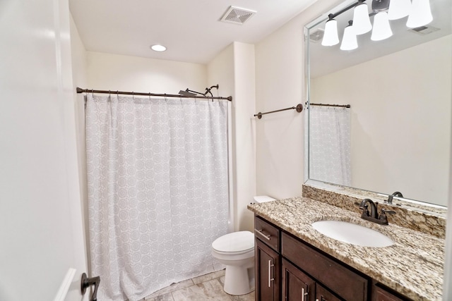 bathroom with vanity, a shower with curtain, and toilet