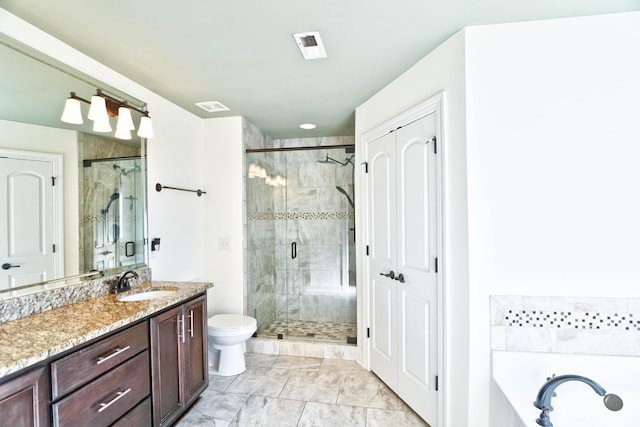 full bathroom with vanity, shower with separate bathtub, and toilet