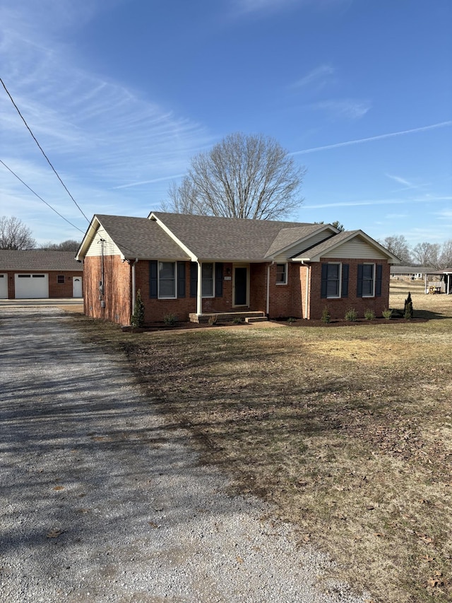 single story home with a garage