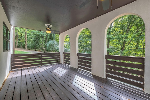 wooden terrace featuring ceiling fan