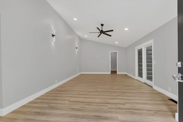 empty room with light hardwood / wood-style flooring, vaulted ceiling, and ceiling fan