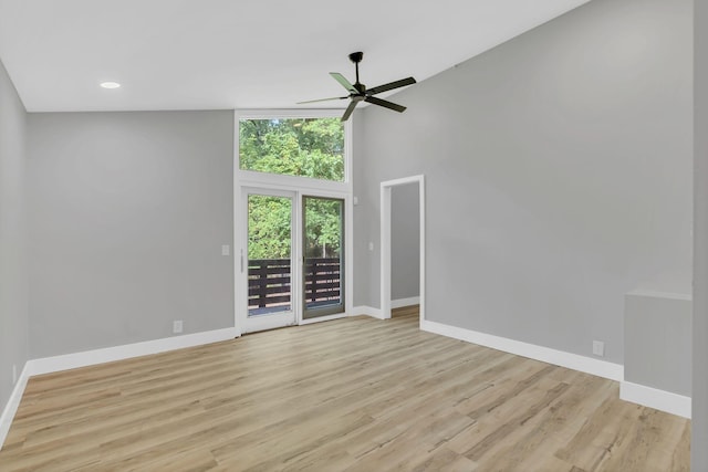 spare room with light hardwood / wood-style floors and ceiling fan