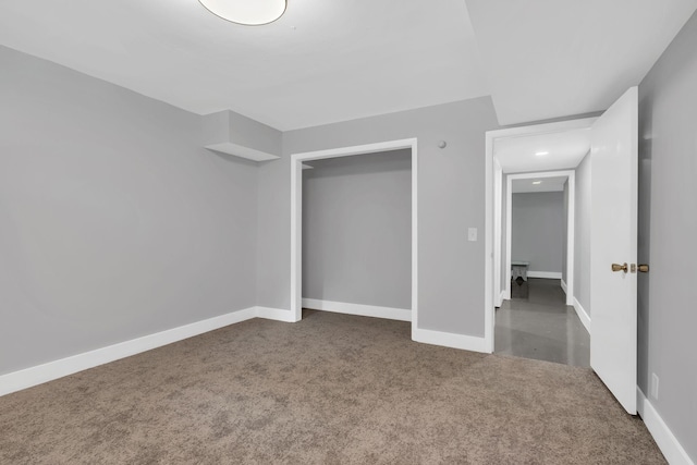 unfurnished bedroom featuring dark carpet