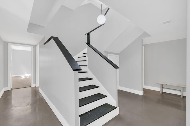 stairs with concrete floors