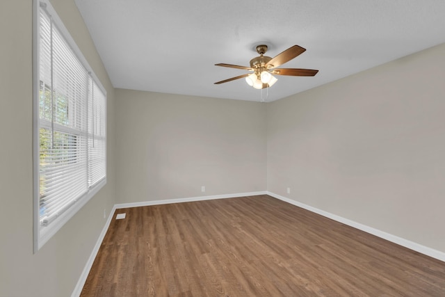 unfurnished room with ceiling fan and hardwood / wood-style floors