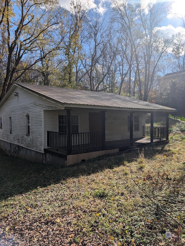 view of property exterior featuring a porch