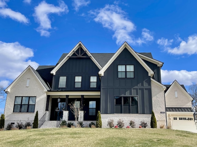 view of front of house with a garage and a front yard