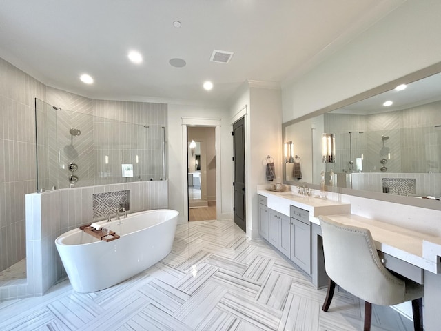 bathroom featuring vanity and separate shower and tub