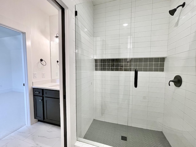 bathroom with vanity and a shower with shower door