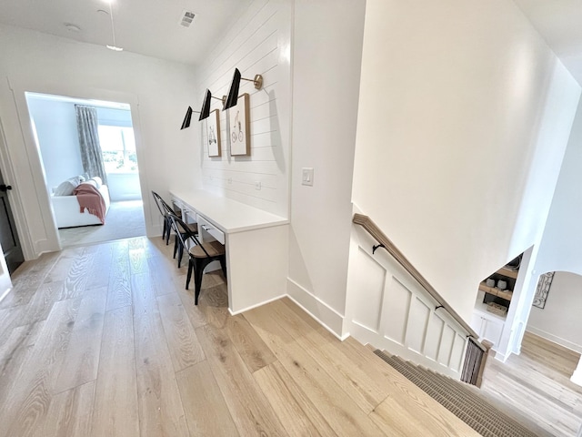 hallway with light wood-type flooring