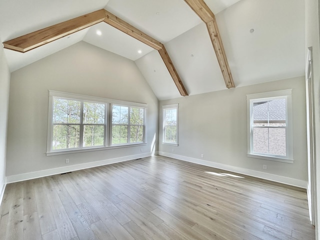 interior space featuring beamed ceiling, high vaulted ceiling, and light hardwood / wood-style floors