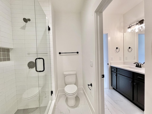 bathroom with vanity, toilet, and a shower with shower door