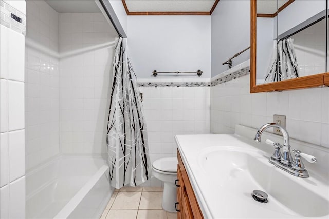 full bathroom featuring shower / tub combo with curtain, tile walls, tile patterned flooring, vanity, and ornamental molding