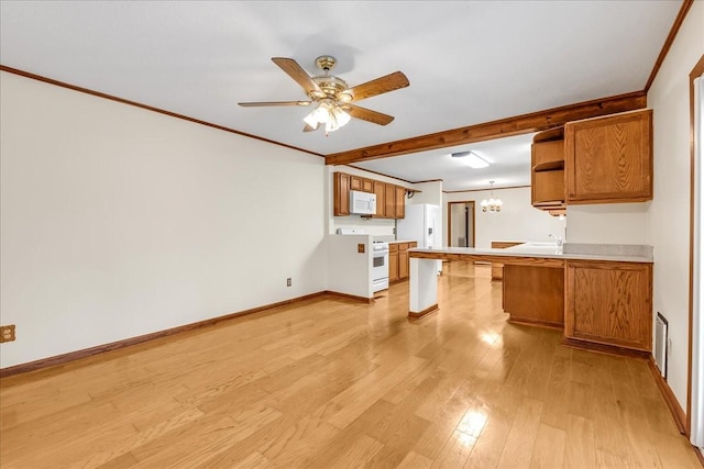 kitchen with white appliances, ornamental molding, kitchen peninsula, and light wood-type flooring