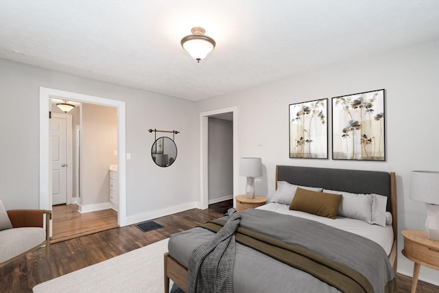 bedroom with dark wood-type flooring