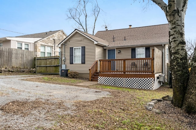 back of property with a wooden deck