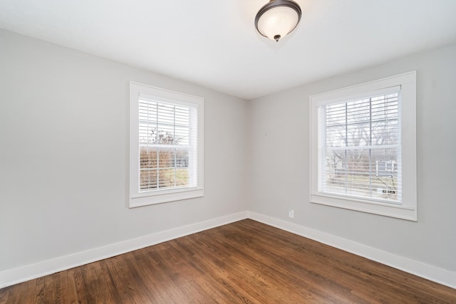 empty room with hardwood / wood-style floors