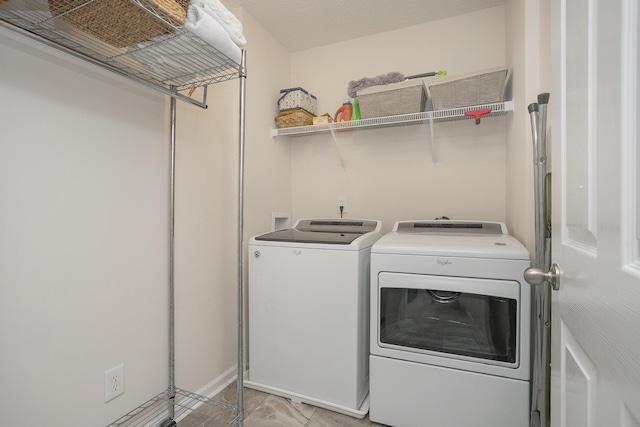 laundry area with independent washer and dryer