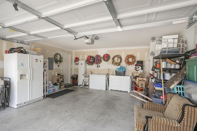 garage with a garage door opener, white refrigerator with ice dispenser, and electric panel