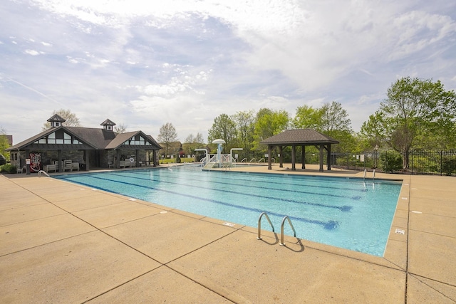 view of swimming pool featuring a gazebo and a patio