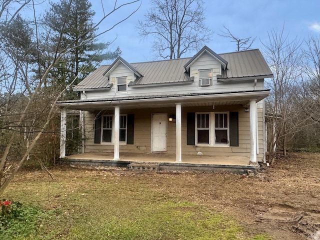 view of front of house featuring a porch and metal roof