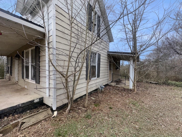 view of side of home with a patio